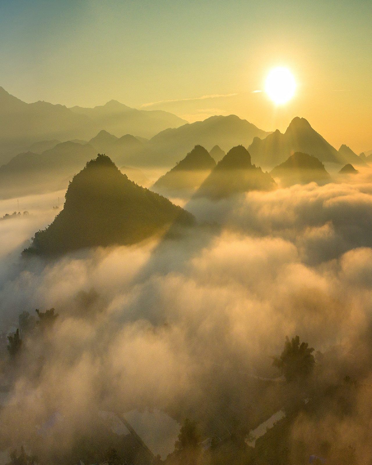 Northern peaks above a sea of cloud at first light